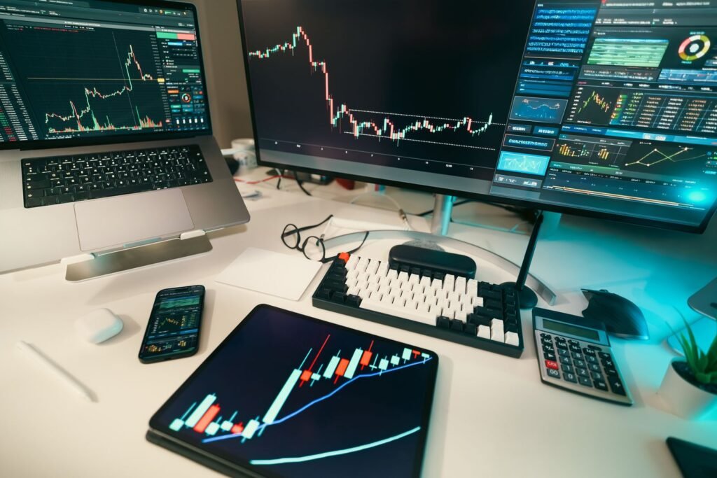 Trading desk with financial charts on screens for day trading