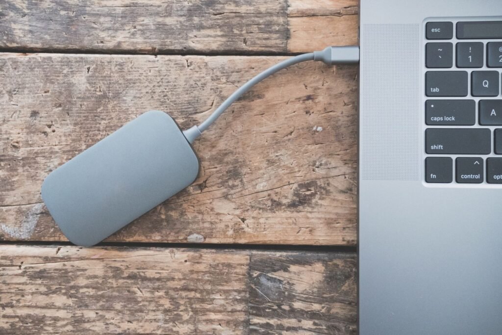 External drive connected to a laptop for storing downloaded files