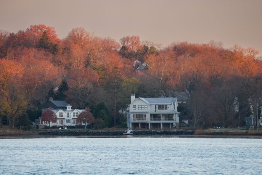 Connecticut or Oklahoma: Which State Is Better to Live In? Waterfront homes framed by autumn foliage in Stamford, Connecticut
