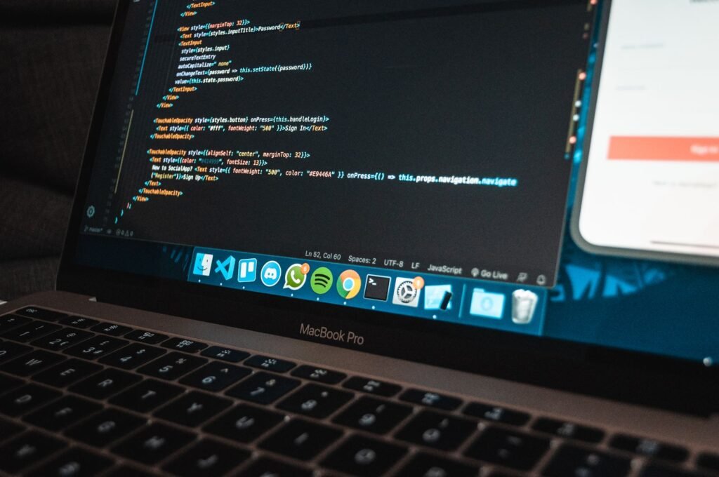 Workplace with a laptop showing program code for a WordPress site