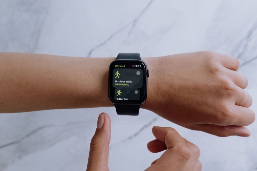 Close-up of a black smartwatch on a wrist displaying a health tracking app