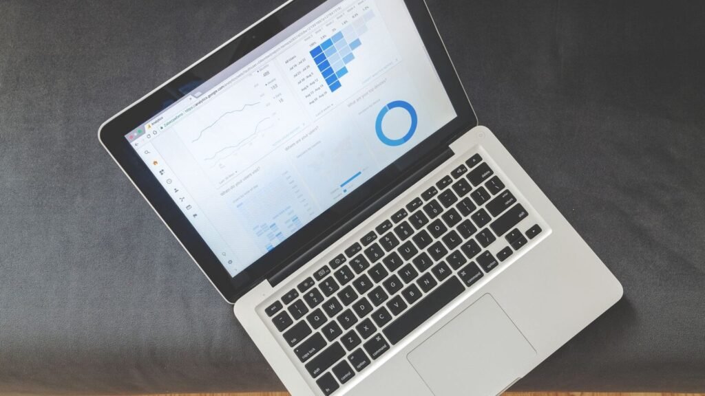 Overhead view of a laptop showing data charts