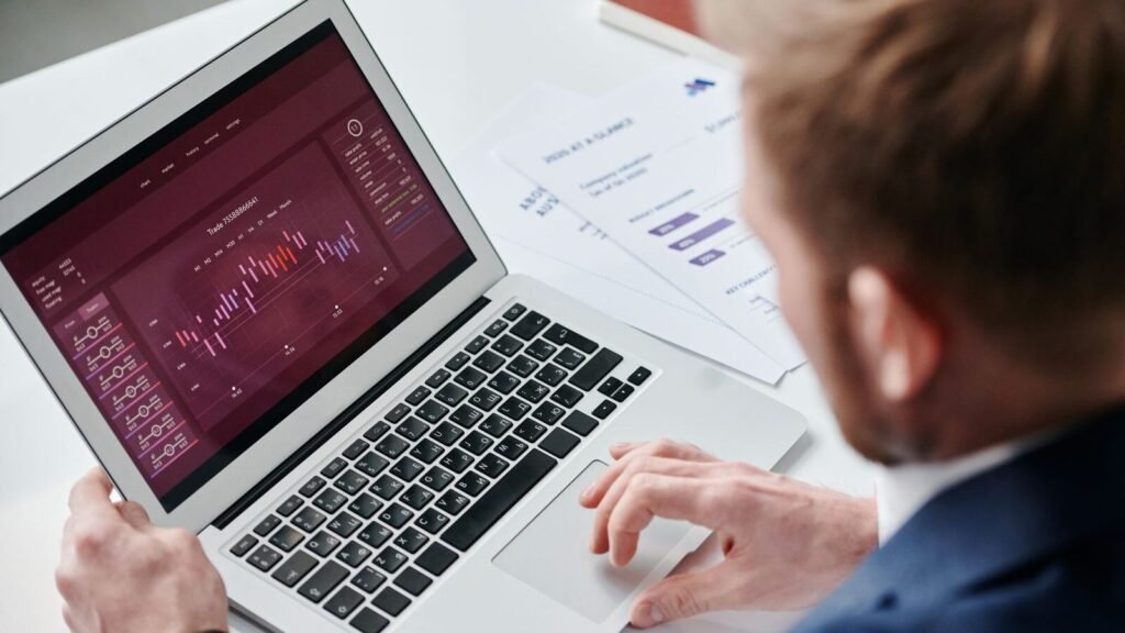 Businessman reviewing a data dashboard on a laptop