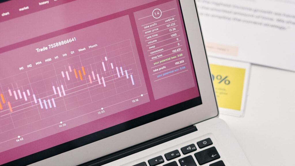 Laptop showing website analytics graphs for tracking traffic