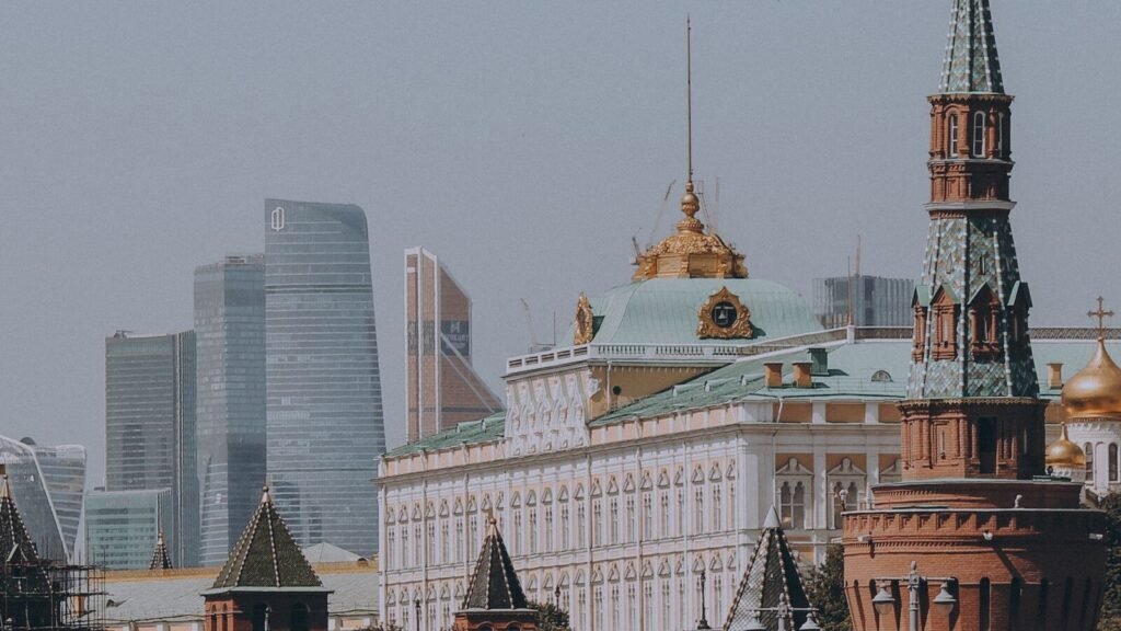 Moscow Kremlin walls and towers with modern skyscrapers in the background