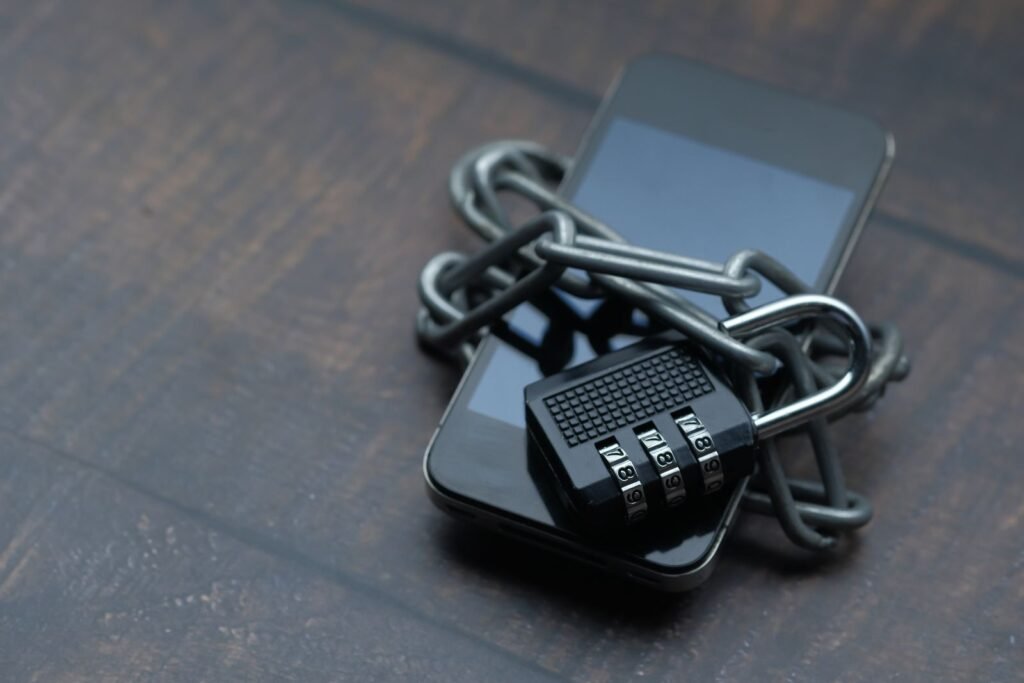 Smartphone wrapped in a chain with a padlock, illustrating Pixel 11 Titan M3 post-quantum security