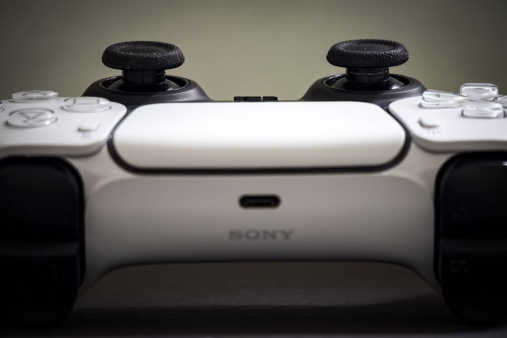 Red Dead Redemption 2 Drops to $14.99 on PlayStation, and the Clock Runs Out Wednesday Close-up of a PlayStation 5 DualSense controller resting on a dark surface