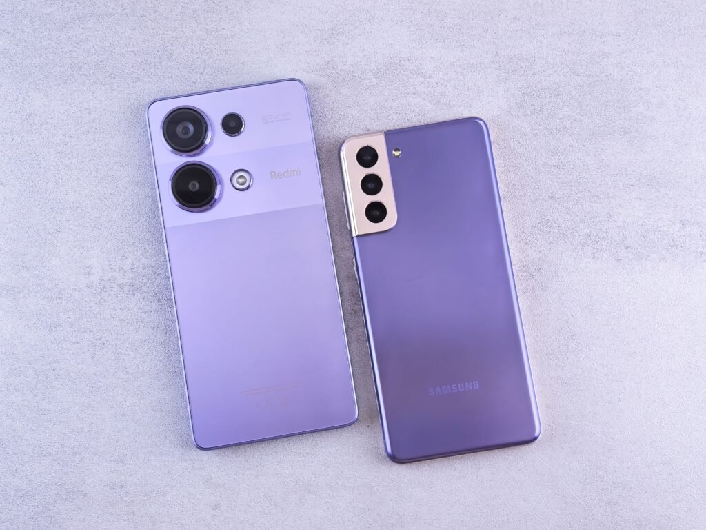 Two smartphones placed side by side on a light surface for comparison