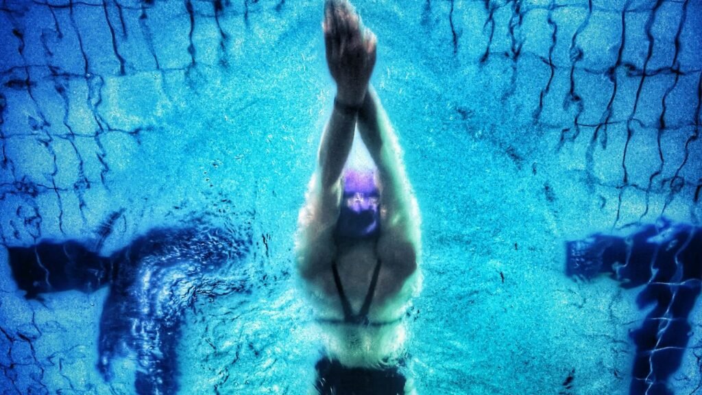 Best Smartwatch for Swimming in 2026: Pool and Open Water Picks That Actually Work Underwater view of a swimmer, the kind of session tracked by the best smartwatches for swimming