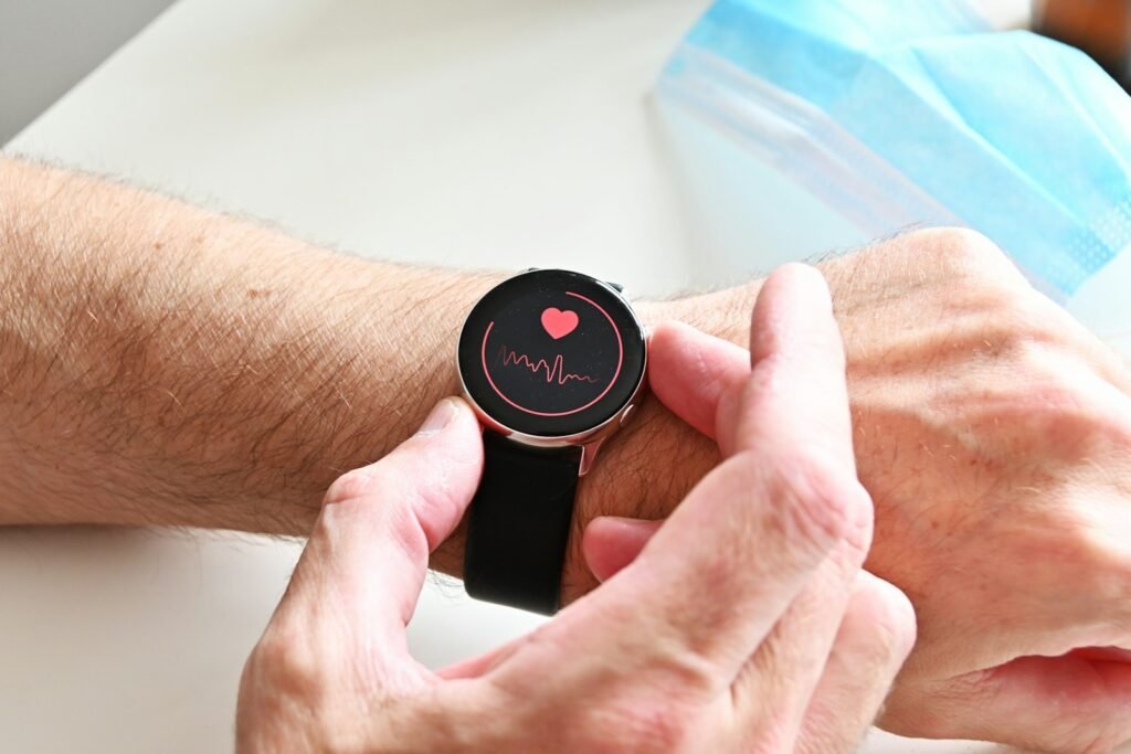 Person checking a heart rate reading on a smartwatch on their wrist