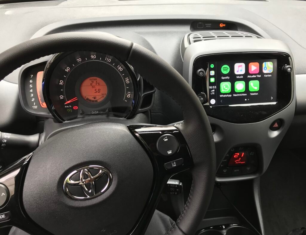 Apple CarPlay interface displayed on the dashboard touchscreen of a Toyota Aygo
