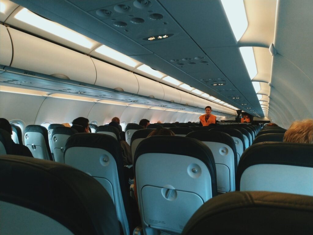 Passengers seated in the cabin of a commercial airliner