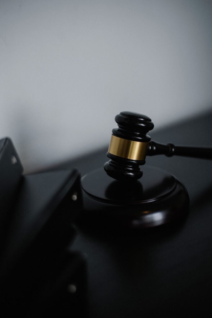 Black wooden judge's gavel resting on a desk, representing the Apple Watch patent ruling