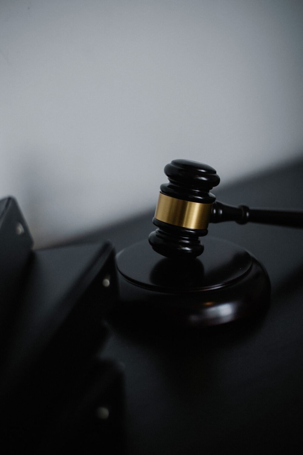 Black wooden judge's gavel resting on a desk, representing the Apple Watch patent ruling