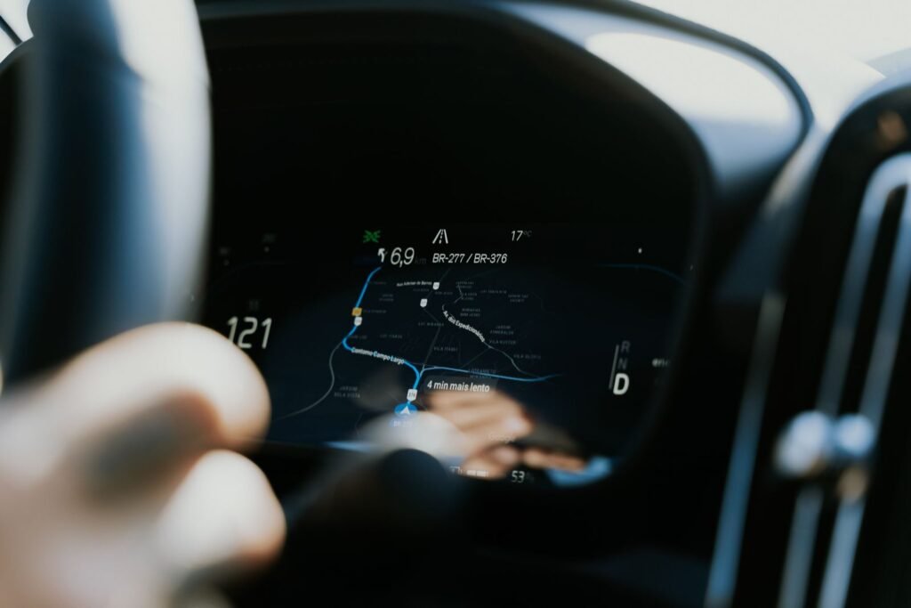 Navigation screen glowing on a car dashboard while driving