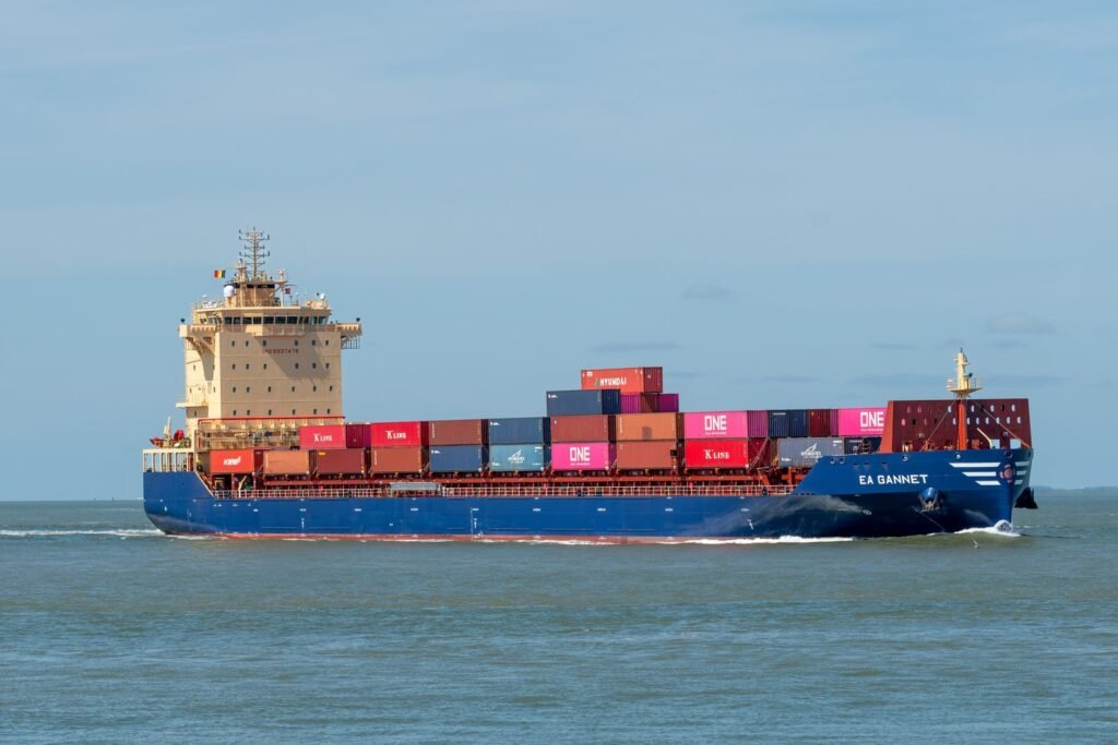 Cargo freighter loaded with shipping containers on open water