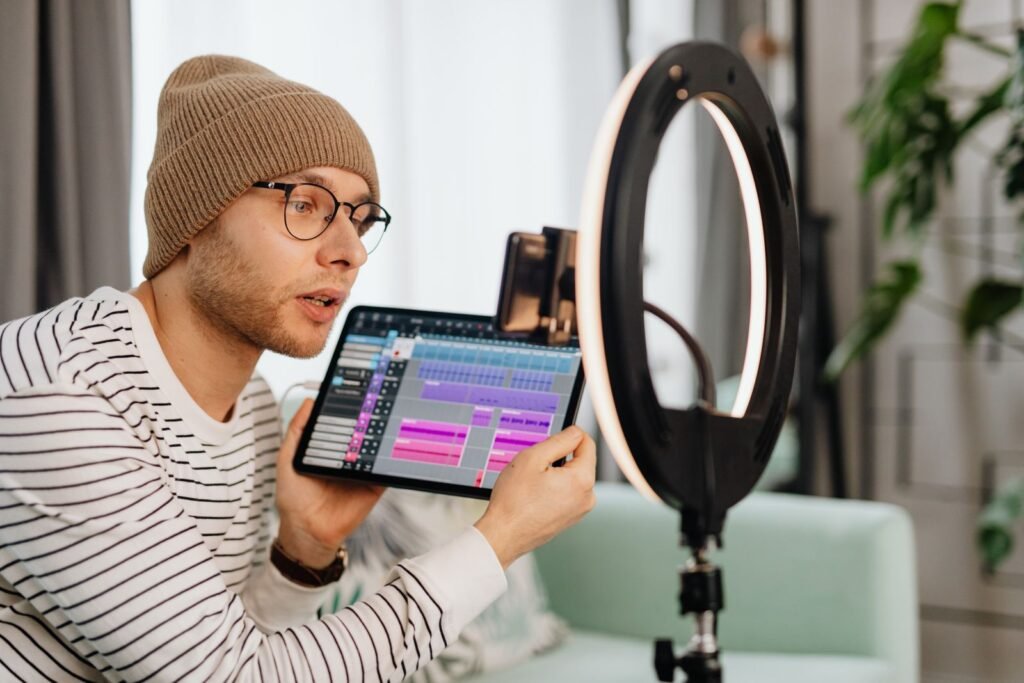 A young creator records a video indoors using a tablet and a ring light, the format at the centre of a row over sponsored AI safety content