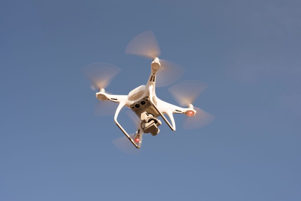 Low angle shot of a drone flying against a clear sky