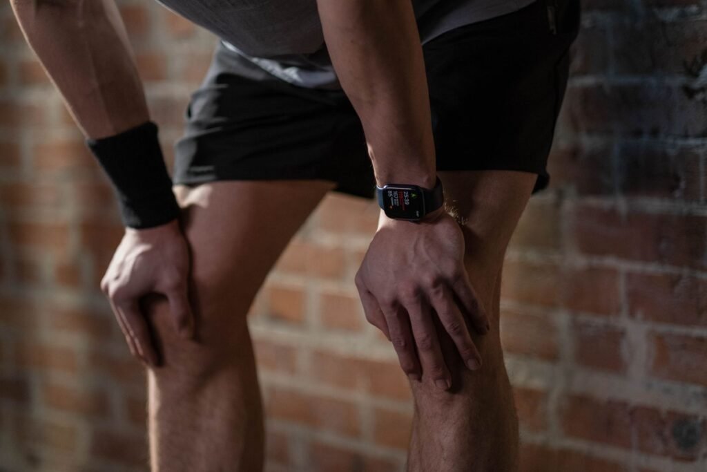 Athlete wearing a black armband and a digital sports watch