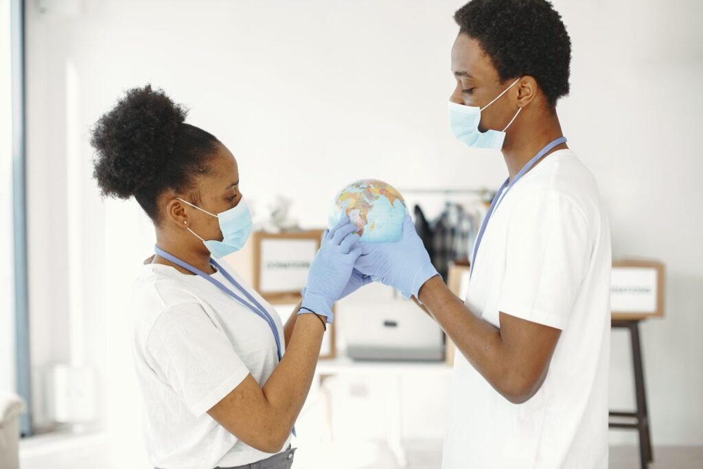 The Lancet Put Malicious AI Next to Nuclear War. Your Diet Is Still the Bigger Threat. Medical professionals in masks and gloves holding a globe