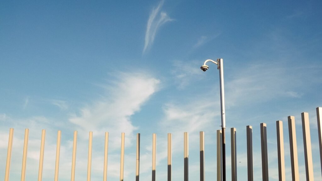 Pole-mounted surveillance camera above a roadside, the kind of hardware MapQuest's Surveillance Layer plots